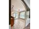 Eat-in kitchen area with ceramic floors, pendant lighting, and natural light streaming through the French doors at 12904 Windy Lea Ln, Huntersville, NC 28078