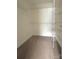 Walk-in closet with carpet flooring and metal racking system and shelving at 12904 Windy Lea Ln, Huntersville, NC 28078