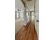 Inviting foyer with hardwood floors, decorative columns, and an open layout to the spacious living area at 12904 Windy Lea Ln, Huntersville, NC 28078