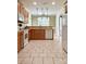 Well-designed kitchen with modern appliances, ceramic flooring, and an open-concept layout at 12904 Windy Lea Ln, Huntersville, NC 28078