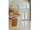 The kitchen features stainless steel appliances, breakfast bar, ceramic floors, and lots of natural light at 12904 Windy Lea Ln, Huntersville, NC 28078