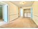 Upstairs landing with laundry room, featuring a washer, dryer, and shelving at 12904 Windy Lea Ln, Huntersville, NC 28078
