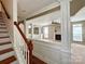 Bright living room featuring decorative columns, fireplace, and windows allowing for plenty of natural light at 12904 Windy Lea Ln, Huntersville, NC 28078