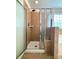 Large tiled shower stall with glass door and tile accents at 12904 Windy Lea Ln, Huntersville, NC 28078