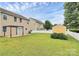 Expansive backyard with a storage shed, pergola covered patio, and well-maintained lawn at 13407 Morgan Lee Ave, Charlotte, NC 28213