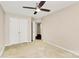 This bedroom offers neutral paint, plush carpet and a ceiling fan at 13407 Morgan Lee Ave, Charlotte, NC 28213