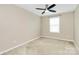 Bright bedroom with neutral walls, a ceiling fan, and large window at 13407 Morgan Lee Ave, Charlotte, NC 28213