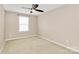 Bright bedroom with neutral walls, a ceiling fan, and large window at 13407 Morgan Lee Ave, Charlotte, NC 28213