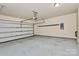 Spacious two car garage with epoxy flooring, electric door opener, and plenty of storage space at 13407 Morgan Lee Ave, Charlotte, NC 28213