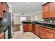 Modern kitchen with stainless steel appliances, granite counters and an open view to the living room at 13407 Morgan Lee Ave, Charlotte, NC 28213