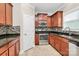 Well-equipped kitchen featuring stainless steel appliances, granite countertops, tile floors and mosaic backsplash at 13407 Morgan Lee Ave, Charlotte, NC 28213