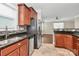Well-lit kitchen with stainless steel appliances, granite countertops, mosaic tile backsplash, and tile floor at 13407 Morgan Lee Ave, Charlotte, NC 28213