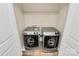 Convenient laundry area equipped with modern washer and dryer, and ample overhead storage at 13407 Morgan Lee Ave, Charlotte, NC 28213