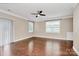 Open living room with hardwood floors, neutral walls and a sliding glass door to the exterior at 13407 Morgan Lee Ave, Charlotte, NC 28213