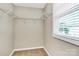 Bright walk-in closet with wire shelving and a window for natural light at 13407 Morgan Lee Ave, Charlotte, NC 28213
