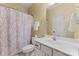 Bathroom with vanity, toilet and bathtub with shower at 13716 Glen Abbey Dr, Charlotte, NC 28278