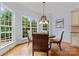 Charming breakfast nook featuring many windows and hardwood flooring at 13716 Glen Abbey Dr, Charlotte, NC 28278