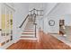 Elegant entryway with hardwood floors and staircase at 13716 Glen Abbey Dr, Charlotte, NC 28278