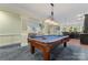 Spacious game room featuring a pool table and an opening to a living space at 13716 Glen Abbey Dr, Charlotte, NC 28278