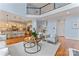 Open floor plan featuring hardwood floors, a sitting area, and a view of the kitchen and upper level at 13716 Glen Abbey Dr, Charlotte, NC 28278