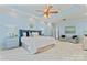 Spacious main bedroom with a tray ceiling, sitting area, and ample closet space at 13716 Glen Abbey Dr, Charlotte, NC 28278