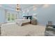 Serene main bedroom featuring plush carpeting, a tray ceiling, and ample natural light at 13716 Glen Abbey Dr, Charlotte, NC 28278