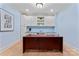 Cozy home office with laminate floors, ample cabinet space, and a serene color scheme at 13716 Glen Abbey Dr, Charlotte, NC 28278