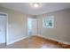 This bedroom features hardwood floors and an ensuite bath at 1401 Hillwood Ct, Charlotte, NC 28210