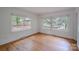 Empty bedroom showcasing hardwood floors and natural lighting at 1401 Hillwood Ct, Charlotte, NC 28210