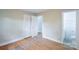 This bedroom features hardwood floors and an ensuite bath at 1401 Hillwood Ct, Charlotte, NC 28210