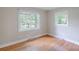 Empty bedroom with hardwood floors and large windows at 1401 Hillwood Ct, Charlotte, NC 28210