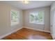 Empty bedroom with hardwood floors and a lot of light at 1401 Hillwood Ct, Charlotte, NC 28210