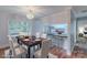Bright dining area with wood floors and a view into the kitchen area at 1401 Hillwood Ct, Charlotte, NC 28210