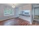 Cozy dining space with hardwood floors, natural light, and open flow to the kitchen at 1401 Hillwood Ct, Charlotte, NC 28210