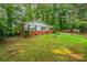 A well-maintained brick home featuring a lush green yard at 1401 Hillwood Ct, Charlotte, NC 28210