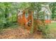 A brick home featuring lush landscaping and exterior building features at 1401 Hillwood Ct, Charlotte, NC 28210