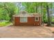 Charming brick home with a mature tree-lined lot and ample parking space in a quiet neighborhood at 1401 Hillwood Ct, Charlotte, NC 28210