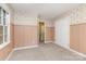 Bedroom with decorative wallpaper, large closet, and access to bathroom at 14027 Hackamore Dr, Matthews, NC 28105