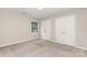This bedroom features neutral paint and carpet, a bright window and closet with double doors at 14027 Hackamore Dr, Matthews, NC 28105