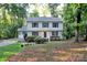 Traditional two-story home featuring a cozy front porch and well-maintained landscaping at 14027 Hackamore Dr, Matthews, NC 28105