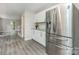 Bright eat-in kitchen featuring stainless steel refrigerator and modern countertops at 14027 Hackamore Dr, Matthews, NC 28105