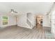 Inviting living room showcasing stairs to the 2nd floor and an open floor plan at 14027 Hackamore Dr, Matthews, NC 28105