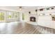 Cozy living room with a brick fireplace, built-in shelving, and ample natural light at 14027 Hackamore Dr, Matthews, NC 28105