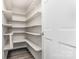 Walk-in pantry boasts generous shelving for optimal storage at 14027 Hackamore Dr, Matthews, NC 28105