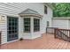 This rear deck and door offer exterior access with stairs leading to the backyard of the home at 14027 Hackamore Dr, Matthews, NC 28105