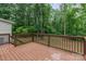 The rear deck offers treed views and access to a large backyard at 14027 Hackamore Dr, Matthews, NC 28105