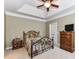 A comfy bedroom boasts tray ceilings, neutral walls, with coordinating dressers and night stands at 147 Wren Hill Dr, Mooresville, NC 28115