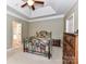 A cozy bedroom features neutral walls and tray ceilings, creating a serene and inviting atmosphere at 147 Wren Hill Dr, Mooresville, NC 28115
