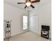 Minimalist bedroom featuring a ceiling fan, window, and a closet with sliding doors at 147 Wren Hill Dr, Mooresville, NC 28115
