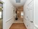 Bright hallway with hardwood floors leads into an open living space with high ceilings at 147 Wren Hill Dr, Mooresville, NC 28115
